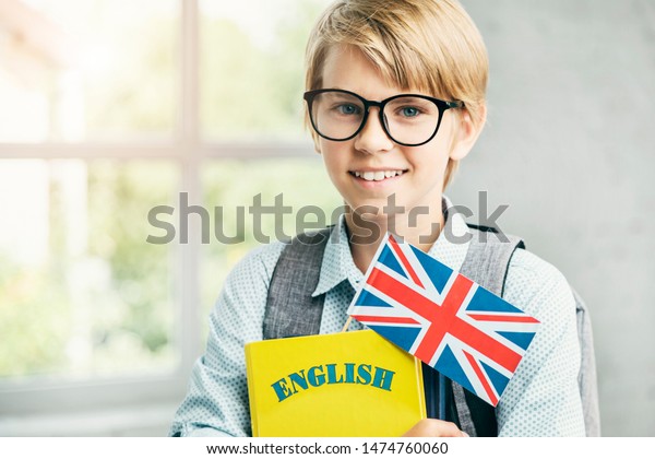 Smiling Blond Pupil  Textbooks British  Banner Stock Photo 