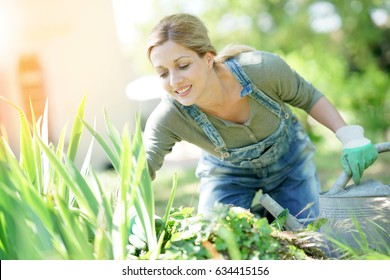 Smiling Blond Woman Gardening 