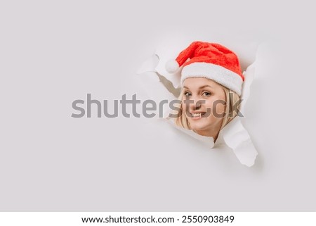 Similar – Image, Stock Photo Woman peeking through Christmas wrapping paper, festive mood
