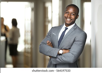 Smiling boss ceo at office work place portrait of worker in suit and tie looking handsome