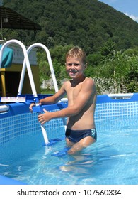 smiling boy in collapsible pool