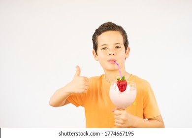 Smiling Boy Drinking A Strawberry Smoothie