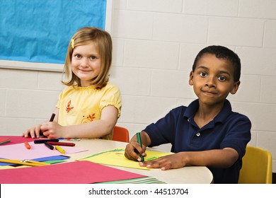 Smiling Boy And Girl Doing Projects In Art Class. Horizontally Framed Shot.