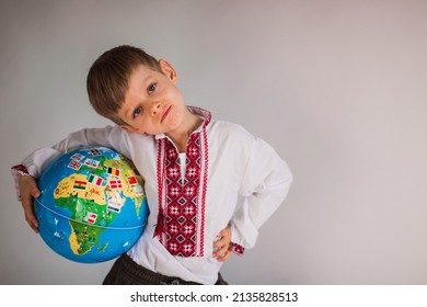 Smiling Boy Holding Globe In Hands