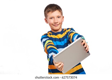 Smiling boy holding a tablet pc and fun, isolated on white background - Powered by Shutterstock