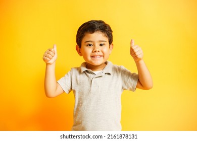 Smiling Boy Raising His Thumbs