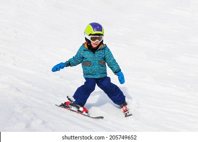 Smiling Boy In Ski Mask Learns Skiing