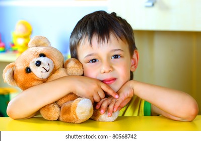 Smiling Boy With A Soft Toy Teddy Bear