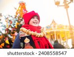 smiling boy at the traditional Russian festival dedicated to the meeting of spring, the week of pancakes, Shrovetide. the child stands at the decorations for the Maslenitsa holiday