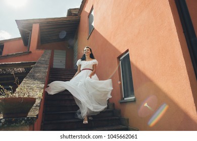 Smiling Bride In The Ancient City. Rome Italy. Wedding Dress. A Beautiful Smiling Bride Is Happy