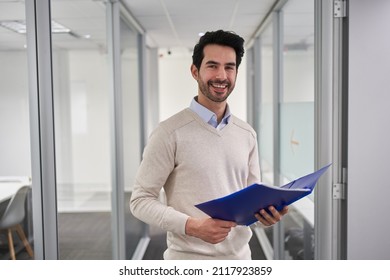 Smiling Business Man As A Successful Start-up Founder With Documents In The Office