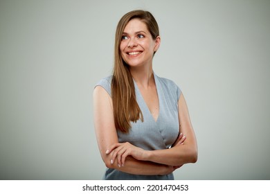 Smiling business woman with arms crossed looking away. isolated portrait.