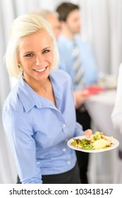 Smiling Business Woman During Company Lunch Buffet Hold Salad Plate