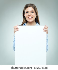 Smiling business woman holding big white banner. Isolated portrait.