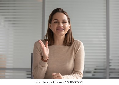 Smiling business woman hr talking with distant client looking at camera calling for online job interview record online training webinar, female teacher coach shoot video training, webcam view