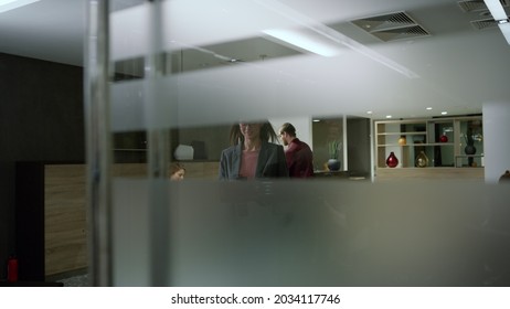 Smiling Business Woman Walking Office Corridor With Smartphone. Closeup Corporate Worker Hand Pressing Lift Button. Confident Businesswoman Entering Lift In Modern Building 