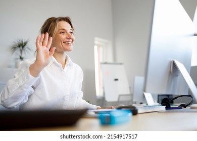 Smiling Business Woman Waving Hello Talking On Video Call