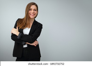 Smiling Business Woman Wearing Black Suit Standing With Crossed Arms. Isolated Portrait On Gray Back.