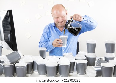 Smiling Businessman Drinks Too Much Coffee