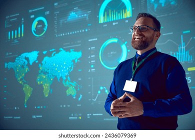 Smiling businessman with glasses presenting analytical data visualizations on large screen. Morning briefings. Concept of business, startup, leadership, personal development courses. - Powered by Shutterstock