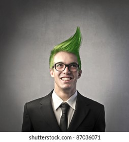 Smiling businessman with green upright hairstyle