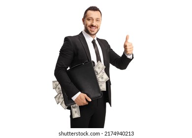 Smiling businessman holding a suitcase full of money and gesturing thumbs up isolated on white background - Powered by Shutterstock - Get 15% off with code: PIKWIZARD15