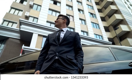 Smiling Businessman Standing Near Premium Class Auto, Saving Money, Banking