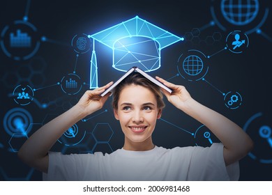 Smiling businesswoman holding an open book on her head and pondering about educational prospective in future career, master degree programs in business administration, postgraduate level.