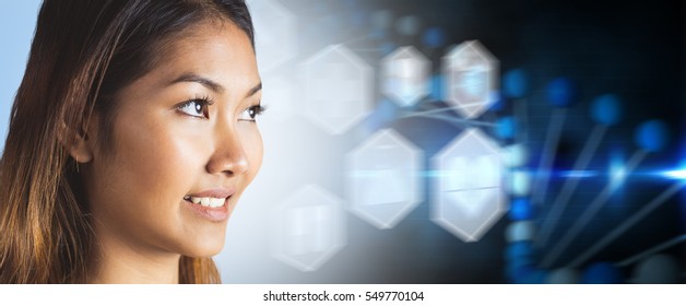 Smiling businesswoman looking away against medical icons in hexagons interface menu - Powered by Shutterstock