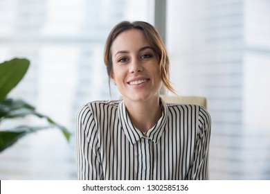 Smiling businesswoman looking at camera webcam make conference business call  recording video blog  talking and client  distance job interview  e  coaching  online training concept  headshot portrait