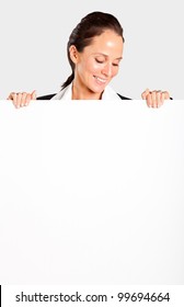 Smiling Businesswoman Looking Down White Board