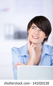 Smiling Businesswoman Sitting Thinking Behind Her Stock Photo (Edit Now ...