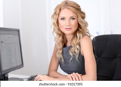 Smiling businesswoman at work in office