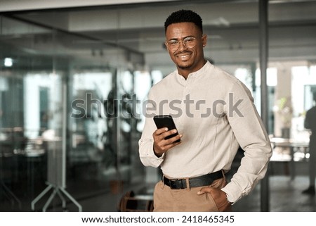 Image, Stock Photo Young black businessman in suit standing on stairs