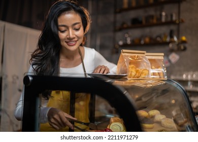 Smiling Cafe Staff Ready To Serve Bakery