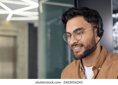 Smiling call center agent wearing a headset, providing customer support in a modern office environment. - Powered by Shutterstock