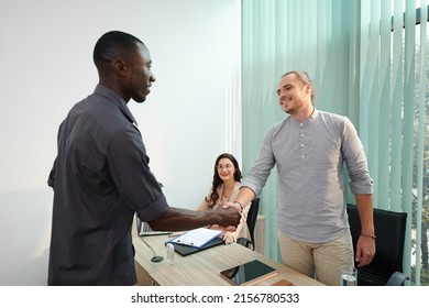 Smiling Candidate Shaking Hand Of Executive Before Second Job Interview In Company