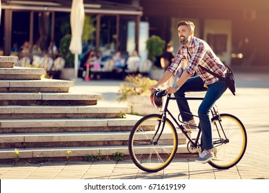 Smiling Casual Businessman Going To Work By Bicycle.