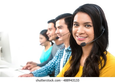 Smiling casual call center (or telemarketer) team