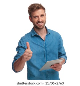 smiling casual man working on tablet makes the ok sign on white background - Shutterstock ID 1170672763