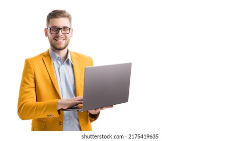 Smiling caucasian entrepreneur typing on keyboard of wireless laptop in studio. Portrait of joyful male person checking project progress online. Copy space over white background. - Shutterstock ID 2175419635