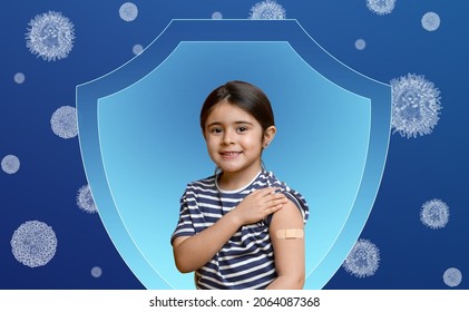 Smiling Caucasian Little Girl Shows On Band Aid On Her Hand After Vaccination In Sign, Protects Against Viruses On Blue Background, Panorama. Vaccination, Immunization, Disease Prevention Concept