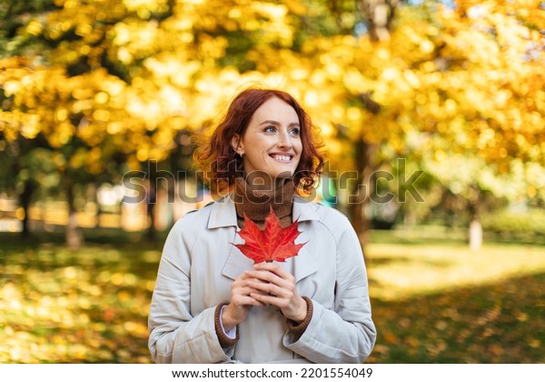 Smiling Caucasian Millennial Redhead Female Raincoat Stock Photo ...