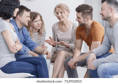 Smiling caucasian people brainstorming in group during business training - Shutterstock ID 712952053