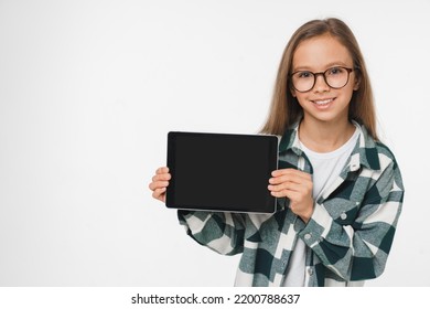 Smiling Caucasian Preteen Teenage Girl Schoolgirl Using Digital Tablet Showing Device Screen Mockup For Mobile Application Isolated In White Background