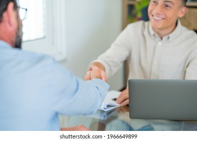 Smiling Caucasian Teenager Hr Manager Handshake Hire Male Candidate At Job Interview Make Good First Impression, Happy Cheerful Young Client Shake Hand Of Bank Broker, Respect, Business Agreement