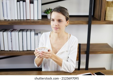 Smiling Caucasian Woman Happy With Smell The Aroma Of Hot Coffee In The Morning At Cafe. She Is Relaxing With Social Online On Laptop With Barista Asian Man. Lifestly And Technology Concept