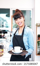 Smiling Caucasian Young barista woman is hand holding a cup  of hot coffee at counter in cafe. Start up for Coffee shop and cafe business. Healthy and business Concept. - Shutterstock ID 2171085047