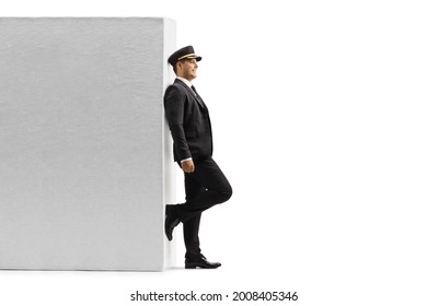 Smiling Chauffeur Leaning On A Wall And Waiting Isolated On White Background