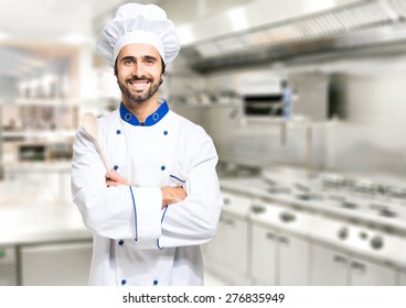 Smiling chef in his kitchen - Powered by Shutterstock